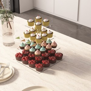 Acrylic cake stand filled with cakes on table