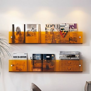 Acrylic transparent magazine rack hangs on the wall